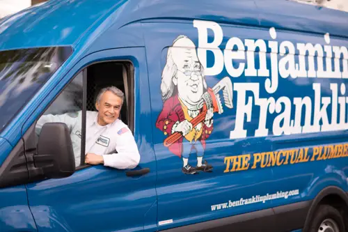 Benjamin Franklin Plumber, Mike, driving his work van onto a job site in Lakeland FL